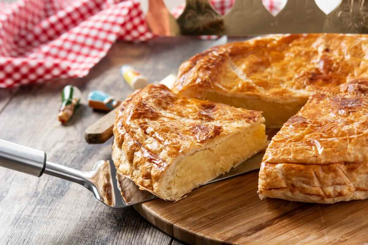 Traditional French Galette des Rois with golden puff pastry and almond frangipane fillin